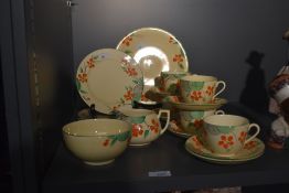 A set of early 20th-century Crown Devon pottery tea set by S. Fielding and Company, featuring a hand