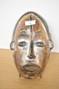 A 19th to 20th-century carved wood African Art sculptural mask, wall hanging to reverse, unmarked,