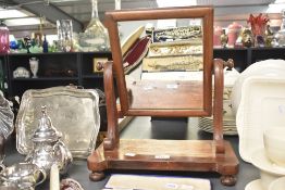 A Victorian mahogany dressing table mirror, raised upon four ball feet, 44cm, condition is