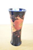 A 20th-century Moorcroft Pomegranate pattern vase, featuring tube lined decoration of pomegranate