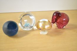 A quantity of four 20th-century studio glass paperweights, including a Caithness Dolphin and a