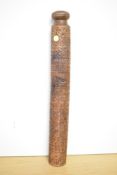 A 20th-century African hand-carved wooden thought to be ceremonial baton, featuring geometric banded