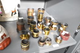 A selection of seventeen brass lenses mostly unnamed