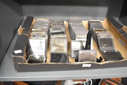 A large quantity of Victorian Magic Lantern glass image slides, typically made of two sheets of
