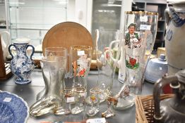 A collection of nine late 20th-century/modern German boot-shaped beer glasses, six featuring novelty