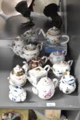 A quantity of 20th-century Victoria and Albert Museum Porcelain miniature tea pots, to include for
