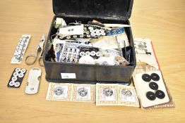 A 20th-century Chinese black lacquer and gilt decorated box filled with vintage sewing notions,