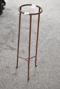 A 20th-century wrought iron plant/vase stand of tripod form, 80cm, condition is consistent with