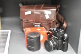 A Zenit 12XP camera with Helio-44M-4 2/58 lens and Helios flash in leather camera bag