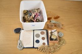 An assortment of costume jewellery, including faux pearls, beaded jewellery, brooches and watch