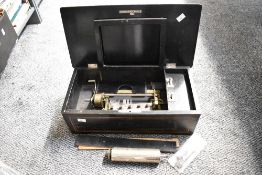 A late 19th to early 20th-century cylinder music box, rosewood with inlaid decorative elements and