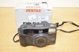 Pentax Espio 928, compact 35mm point-and-shoot film camera with a 28–90mm zoom lens.