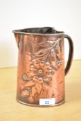 A 20th-century Arts and Crafts Copper Cornish Love Jug-style ewer, having a heart-shaped mouth,