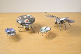 A quantity of contemporary recycled metal folk art, to include a delicately crafted butterfly and