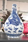 A large Chinese blue and white pottery tianqiuping-style vase, decorated with one large coiled