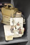An Artisan 300 sewing machine together with Singer Handychest sewing case