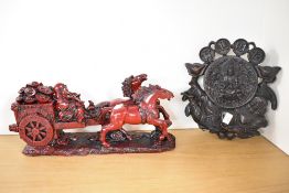 Two modern Chinese Decorative arts resin ornaments, featuring a large red resin statue of horses