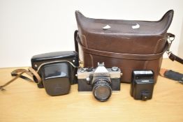 Praktica Super TL2 with Pentacon 50mm f1.8 lens. Sold with a Nissin 300H flash unit, a Weston Master