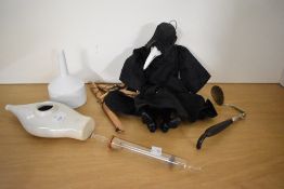 A collection of 20th-century medical and sundry curiosities, to include a hand carved Plague