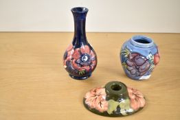 A collection of 20th century Moorcroft pottery, compromising of an Anenome design long neck bud vase