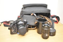 A Nikon F301 35mm film camera, a Tamron SP 35-210mm f 3.5-4.2 lens, a Revue DT-700S Zoom