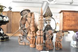 A selection of six 20th-century wood-carved African art sculptures, featuring stylised headdresses