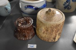 Two late 20th-century tobacco jars, both featuring a log finial and tree stump textured design, both