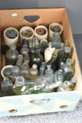A large quantity of late 19th to 20th-century glass and ceramic bottles, to include medicinal,