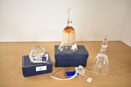 A quantity of 20th-century crystal ware, comprising four items: a Swarovski rose, a Dartington