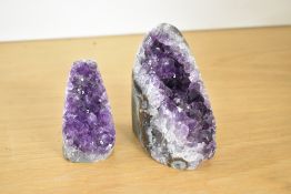 Two 20th-century Amethyst geodes, both featuring a deep purple quartz, 8cm and 10cm.