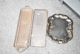 An unusual Arts & Crafts copper tray, of oblong form with slightly raised and pierced edge with