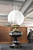 A Victorian oil lamp, featuring a Hinks and Sons Number 2 Duplex burner, a frosted glass globe