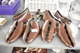 Four pairs of 20th-century Bakelite Shoe Stretchers, marked made in England, three size 9-10 and one