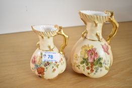 Two Royal Worcester 'Blush Ivory' cream jugs, hand painted with floral designs, h13cm.