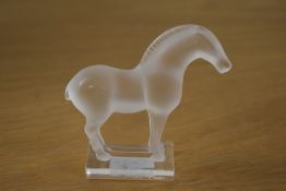 A 20th-century French Lalique frosted crystal 'Tang' horse figurine, featuring a delicately sculpted