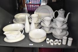 A set of 52 pieces of Royal Doulton English Fine Bone China ‘Carnation’ tableware, including, for