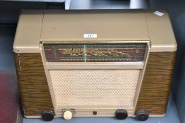 A mid 20th-century Phillips vacuum tube radio, with AC/DC setting with a bakelite case, 44cm
