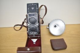 A Rollei Magic reflex camera by Franke & Heidecke in leather cover with boxed Rollei flash and