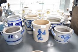 A selection of 20th-century German studio stoneware pottery, having an off white base, decorated