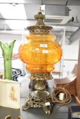 A 20th-century Fenton-style amber glass and gilded metal parlor table lamp, 58cm, condition is