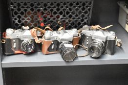 Three Zenit B 35mm cameras, one with a Industar 50mm f3.5 lens, two with Helios 58mm f2 44-2 lens.