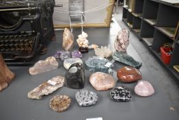 A selection of polished and raw mineral specimens and crystals, to include a variety of amethyst