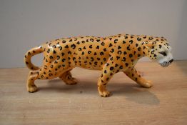 A Beswick Pottery Leopard study, model number 1082 designed by Arthur Gredington in golden brown