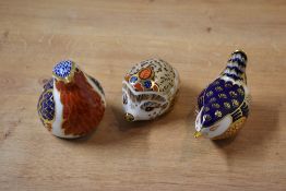 A group of three Royal Crown Derby bone china paperweights, all having Imari style decoration,