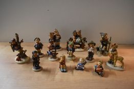 A group of thirteen Goebel porcelain figures and figurines to include 'Friends' model number 136, '