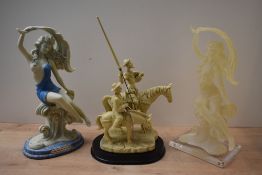 A resin figure group depicting Don Quixote and Sancho Panza, sold together with two Giuseppe