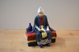 A Reg Johnsons and Sons, Formerly of Royal Doulton, bone china figure 'Omar Khayyam', measures 18.
