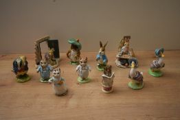 A group of eight Beswick Pottery Beatrix Potter characters to include 'Tommy Brock' and 'Tailor of