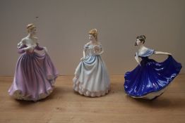 A group of three Royal Doulton bone china figurines comprising 'Elaine' HN 2791, 'Claire' HN 3646