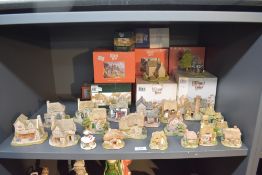 A selection of twenty one Liliput Lane models to include 'The Baker's Shop', 'First Class', 'The